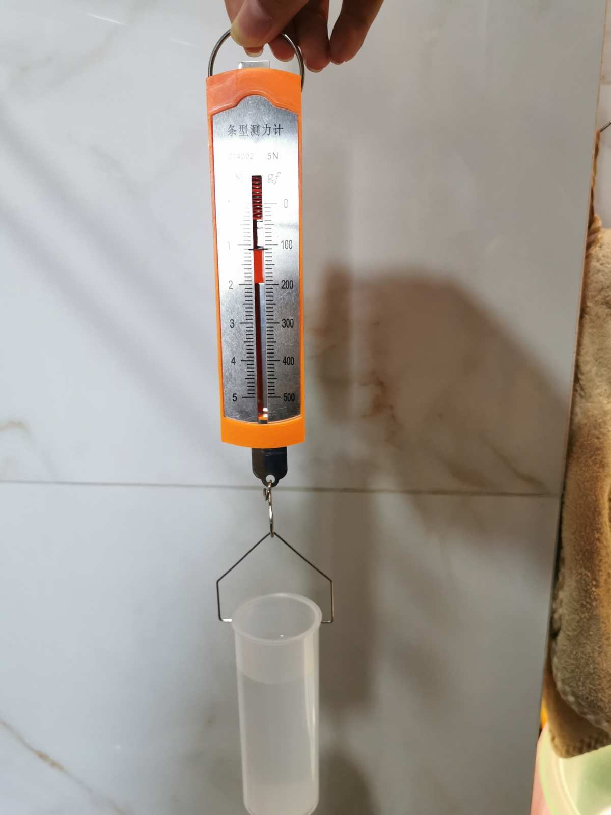 電磁鐵磁力大小實驗_彈力大小計算公式_彈力大小的實驗報告單